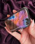 Orange blue pink and violet flash labradorite freeform with sunset horizon effect from Madagascar