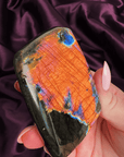 Fiery orange flash labradorite freeform with rainbow edge from Madagascar