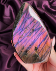 Violet, magenta, and orange flash labradorite freeform with aurora streak pattern from Madagascar